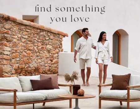 Couple walking towards a luxurious outdoor lounge set