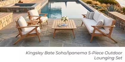 Teak sofa, lounge chairs, and coffee table arranged beside a pool with modern coastal home and ocean views.