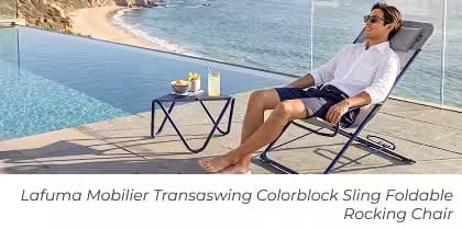Man relaxing in a folding rocking lounge chair beside an infinity pool with ocean views and a matching side table.