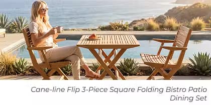 Woman enjoying coffee at a teak folding bistro table set beside a pool with ocean views.